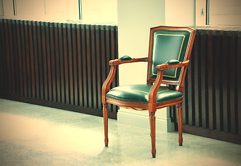 Image showing chair with a leather green seat, back, and armrests