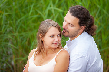 Image showing A young man and a pregnant woman