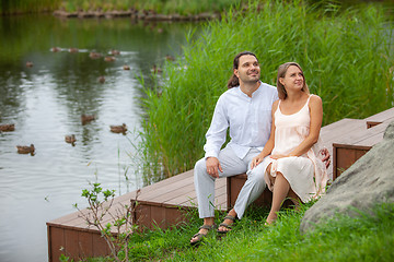 Image showing Happy couple resting by the lake