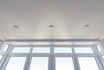 Image showing View of the stretch edafter ceiling and part of the glazed-to-ceiling windows