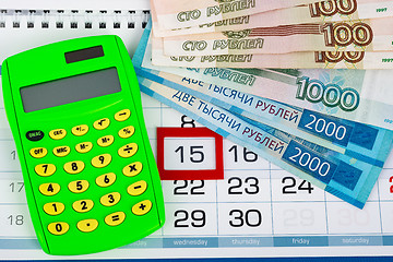 Image showing Calendar with a dedicated 15 number, calculator, Russian rubles