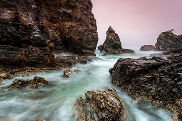 Image showing Jagged beach and rushing water