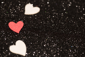 Image showing Hearts over black abstract background with bokeh