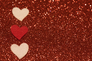 Image showing Hearts over red abstract background with bokeh