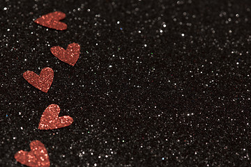 Image showing Hearts over black abstract background with bokeh