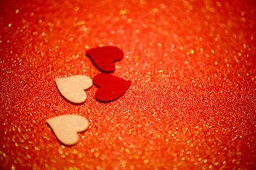 Image showing Hearts over red abstract background with bokeh