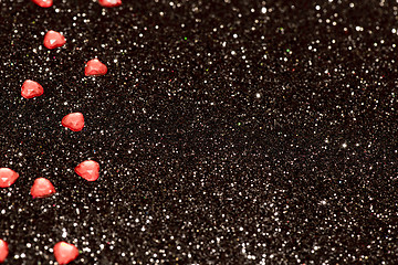 Image showing Hearts over black abstract background with bokeh