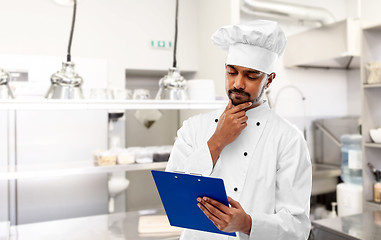 Image showing indian chef with clipboard at restaurant kitchen