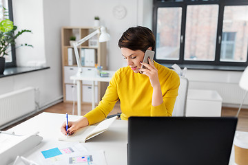 Image showing ui designer calling on smartphone at office