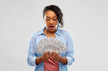 Image showing surprised african american woman with dollar money