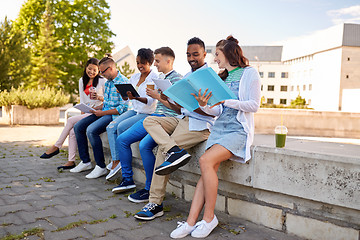 Image showing group of happy students with notebooks and drinks