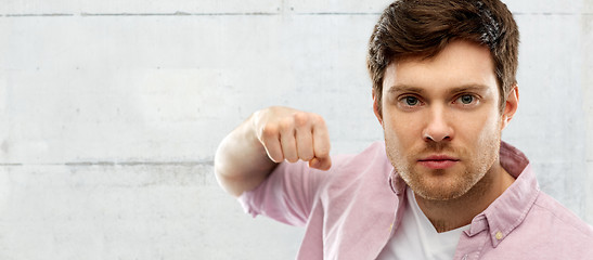 Image showing angry young man ready for fist punch