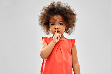 Image showing little african american girl making shush gesture