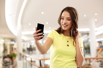 Image showing teenage girl taking selfie in shopping mall