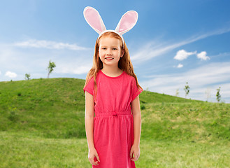 Image showing happy red haired girl wearing easter bunny ears