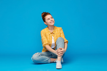 Image showing red haired teenage girl in shirt and torn jeans