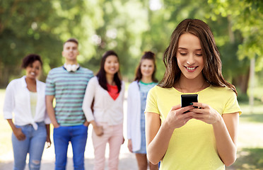 Image showing young woman or teenage girl using smartphone