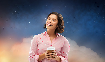 Image showing happy young woman in pajama with cup of coffee