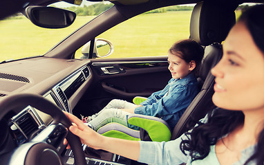 Image showing happy woman with little girl driving in car