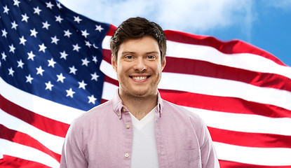 Image showing smiling man over flag of united states of america