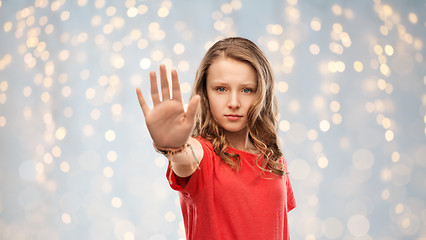 Image showing serious teenage girl showing stop gesture