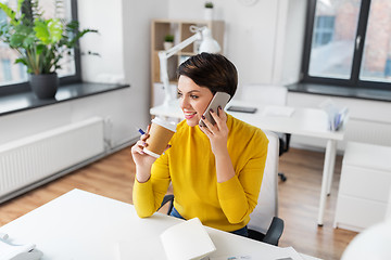 Image showing businesswoman calling on smartphone at office