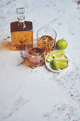 Image showing Whiskey sour drink with lemon in glass on stone rustical background