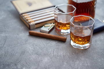 Image showing Carafe of Whiskey or brandy, glasses and box of finnest Cuban cigars