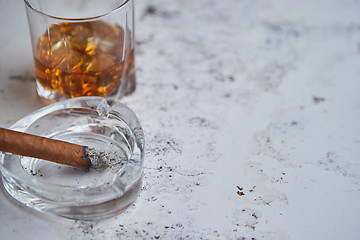 Image showing Whiskey or brandy in a glass with Cuban cigar