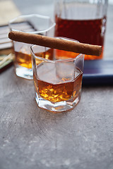 Image showing Carafe of Whiskey or brandy, glasses and box of finnest Cuban cigars