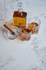 Image showing Bottle and glasses of brandy or wiskey and nice big cuban cigar