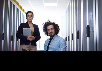 Image showing Team of young technicians working together on servers