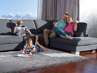 Image showing young happy couple spending time with kids