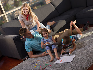 Image showing young happy couple spending time with kids