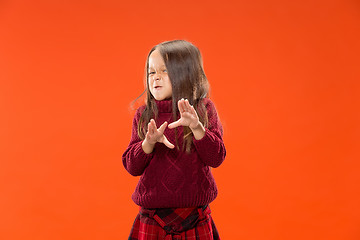 Image showing Portrait of angry teen girl on studio background