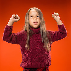 Image showing Portrait of angry teen girl on studio background