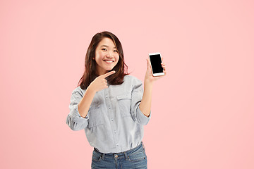 Image showing Portrait of a confident casual girl showing blank screen mobile phone