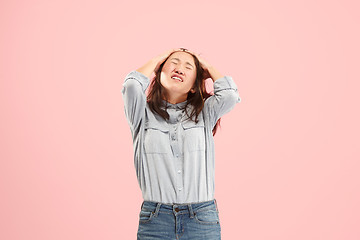 Image showing Beautiful woman looking suprised and bewildered isolated on pink