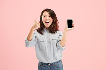 Image showing Portrait of a confident casual girl showing blank screen mobile phone