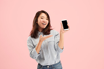 Image showing Portrait of a confident casual girl showing blank screen mobile phone