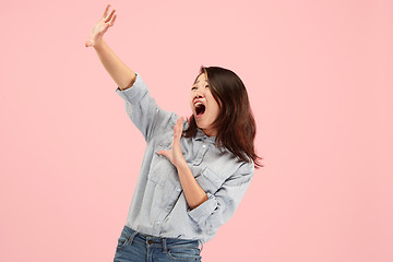 Image showing Portrait of the scared woman on pink