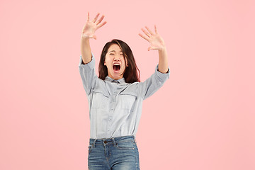 Image showing Portrait of the scared woman on pink