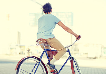 Image showing hipster man riding fixed gear bike