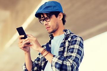 Image showing hipster man texting message on smartphone