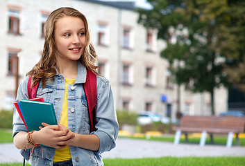 Image showing happy smiling teenage student girl with school bag