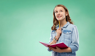 Image showing student girl with notebook over green background