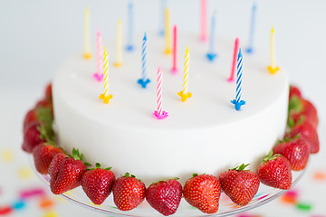 Image showing close up of birthday cake with candles on stand