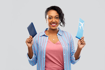 Image showing african woman with passport and air ticket