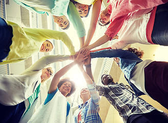 Image showing group of international students with hands on top