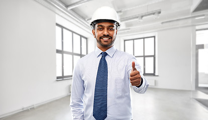 Image showing architect or businessman in helmet shows thumbs up